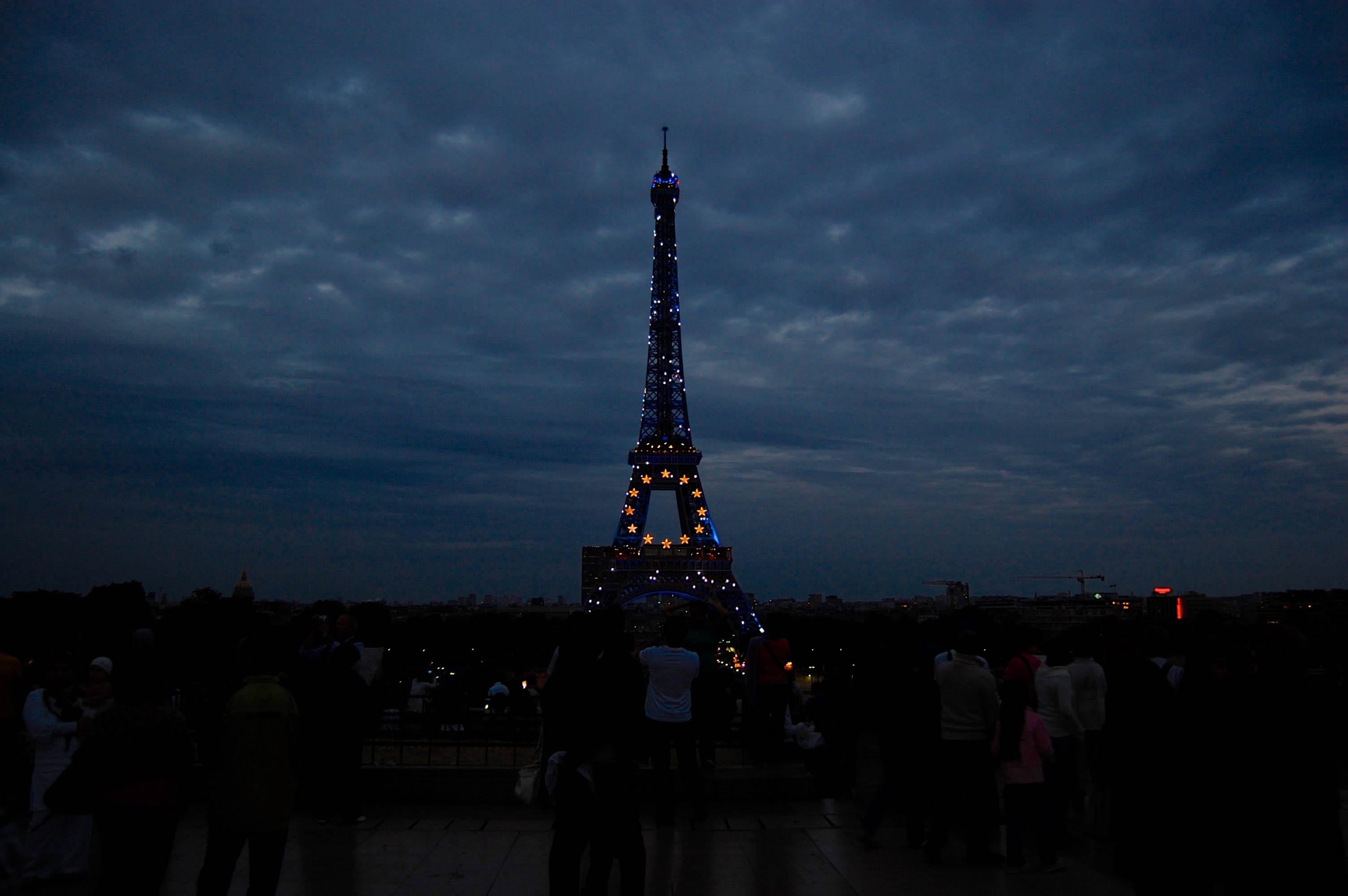 Eiffel Tower lit up in blue Hillfamily dot net